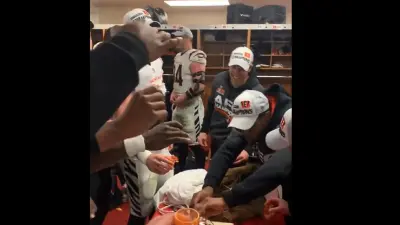 Bengals players hold shot glasses