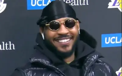 Carmelo Anthony smiling at a press conference