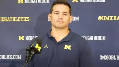 Mike Macdonald talks with the media