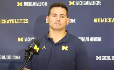 Mike Macdonald talks with the media