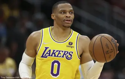 Russell Westbrook dribbles
