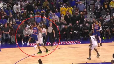 Steph Curry jumps into Kessler Edwards