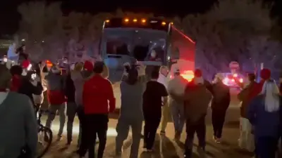 Texas Tech fans follow the bus