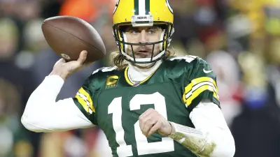 Aaron Rodgers throws a pass
