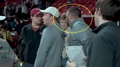 Chris Beard confronts a heckling Oklahoma fan
