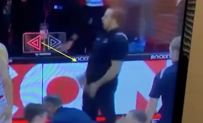 A Wisconsin staffer makes a crude gesture