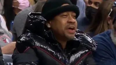 Allen Iverson sitting courtside