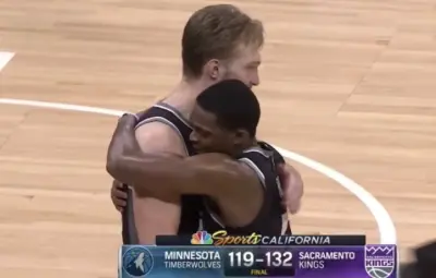DeAaron Fox hugs Domantas Sabonis
