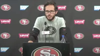 Mike McDaniel at a press conference