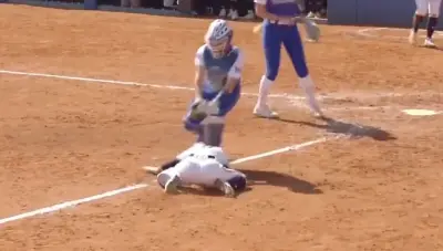 Alex Whitemore avoids a tag