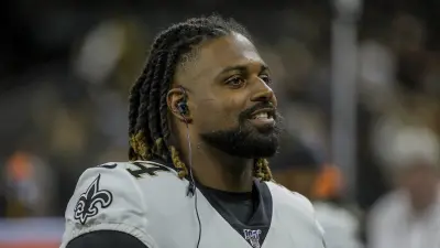 Cameron Jordan wearing earphones