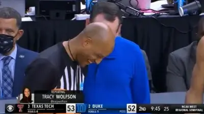 Coach K makes a ref smile