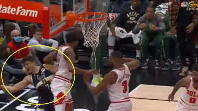 Derrick Jones Jr fouls Grayson Allen
