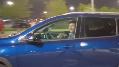 Angel Hernandez smiles at a heckler