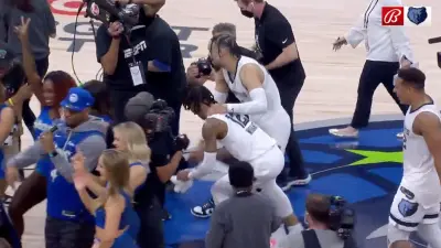 Grizzlies dancing on Timberwolves logo