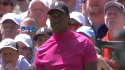 Tiger Woods poses after a shot