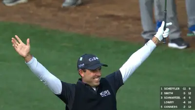 Charl Schwartzel raises his arms