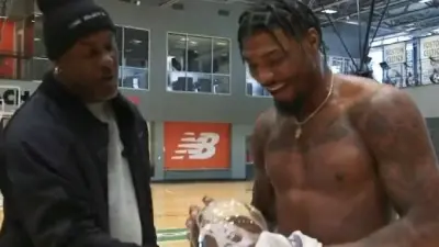 Gary Payton posing with Marcus Smart