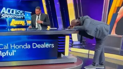 James Worthy hunched over a table