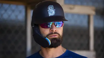 Jesse Winker in a Mariners helmet