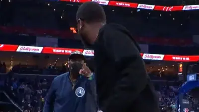 Karl Towns Sr. and Tee Morant talking