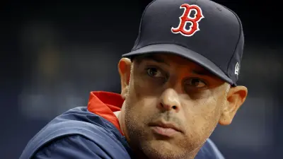 Alex Cora in his Boston Red Sox hat