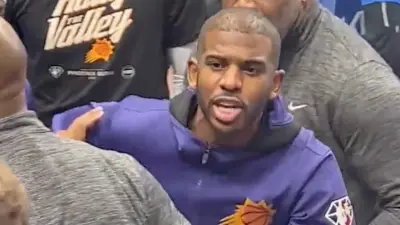 Chris Paul shouts at a Mavericks fan