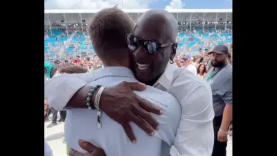 Tom Brady and Michael Jordan share a hug