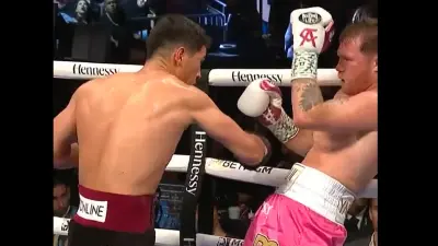 Dmitry Bivol punches Canelo Alvarez