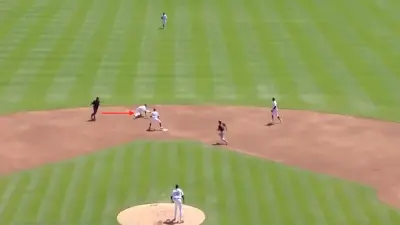 Javier Baez dives for the ball