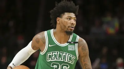 Marcus Smart dribbles the ball