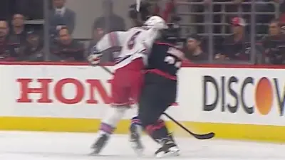Jacob Trouba hits Seth Jarvis