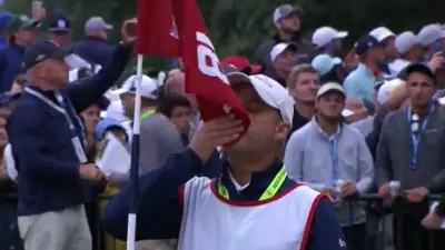Billy Foster kisses the flag