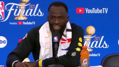Draymond Green talks to reporters