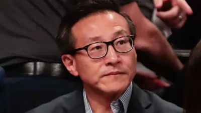 Joe Tsai looking on