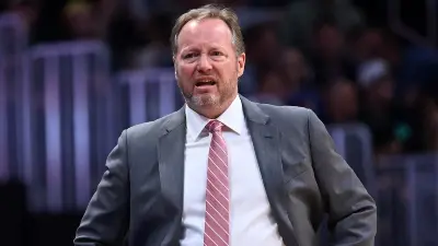 Mike Budenholzer looking on