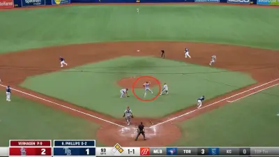 Nolan Arenado making a jumping throw