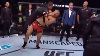 Li Jingliang body slamming one of his coaches.