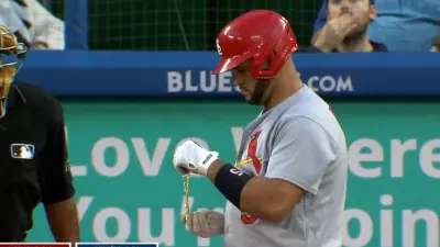 Albert Pujols holds his chain