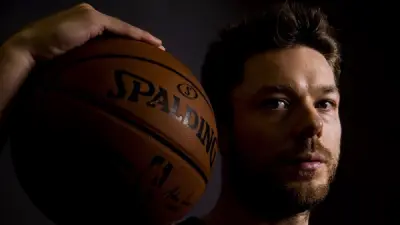 Matthew Dellavedova holding a basketball