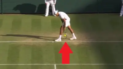 Nick Kyrgios hits a serve