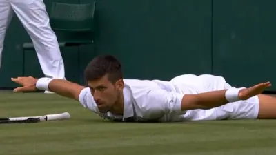 Novak Djokovic spreads his arms