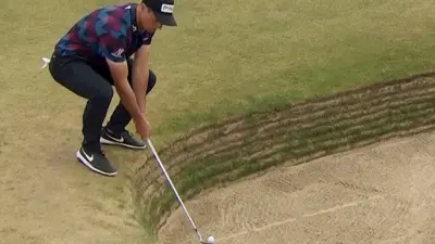 Viktor Hovland squats down