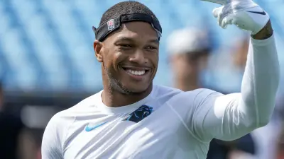 DJ Moore holds up his hand