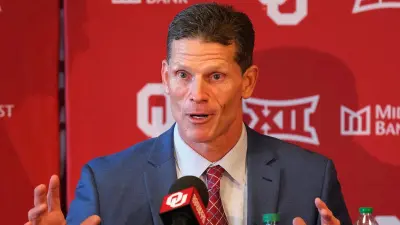 Brent Venables at the podium