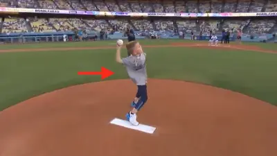 Charlie Freeman throwing a first pitch Freddie Freeman.