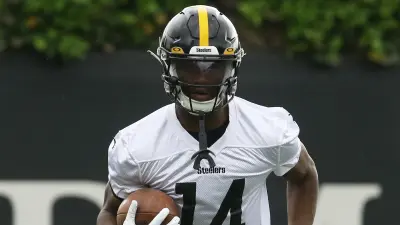 George Pickens holds the ball