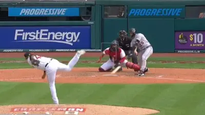 Javy Baez swings at a pitch low