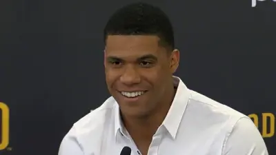 Juan Soto talks with the media