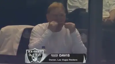 Mark Davis eating a chicken wing.